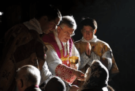 Image result for veiled woman take host eucharist kneel down