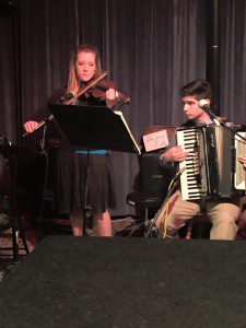 With his good friend Bernadette playing at the Open Mic at the local Coffee House.